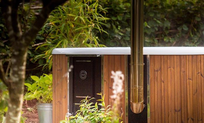 Wood-fired hot tub at Nantseren Glamping
